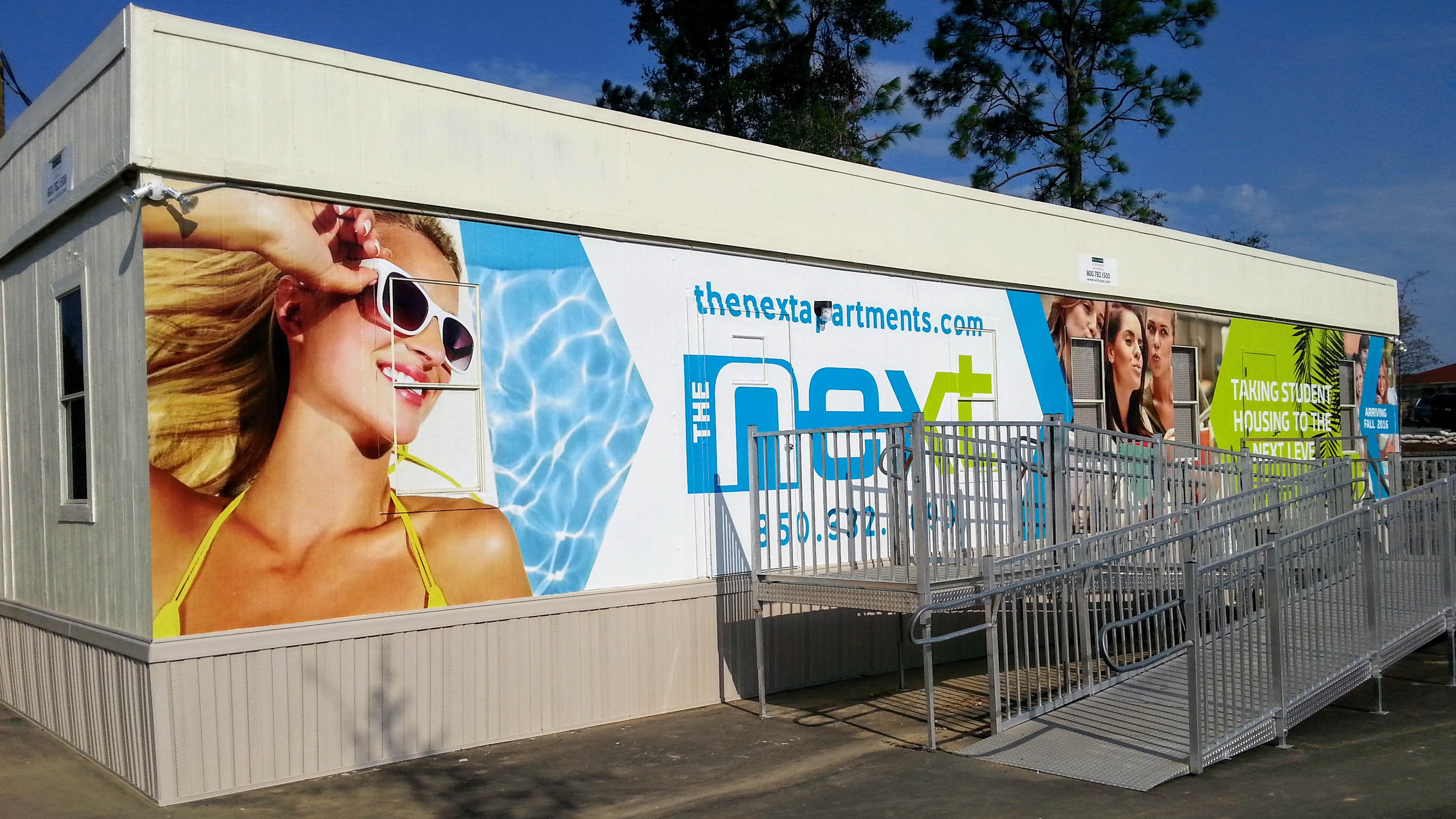 Wall wraps on building exterior - signgeek Wall Wraps & Environmental Graphics 