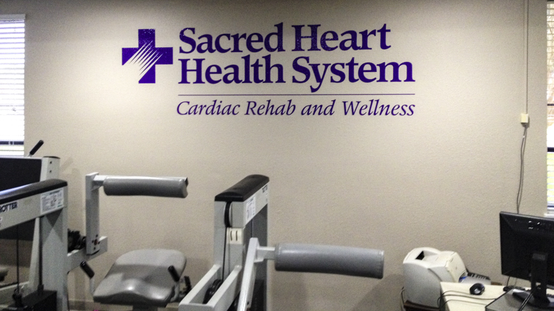 Branded interior vinyl letters for Sacred Heart Health System - signgeek Branded Environments 