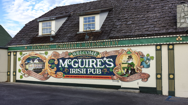 Exterior wall wrap for McGuire's Irish Pub - Signgeek Environmental Graphics 