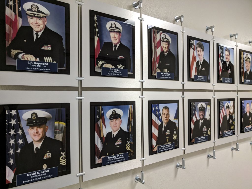 Employee recognition wall display for Naval Hospital Pensacola. Built and installed by signgeek.