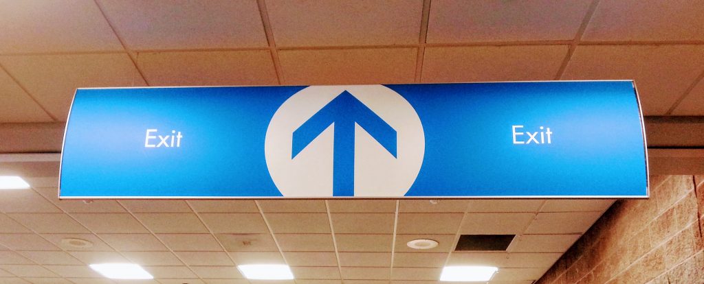 Interior directional sign at Pensacola International Airport by signgeek. 